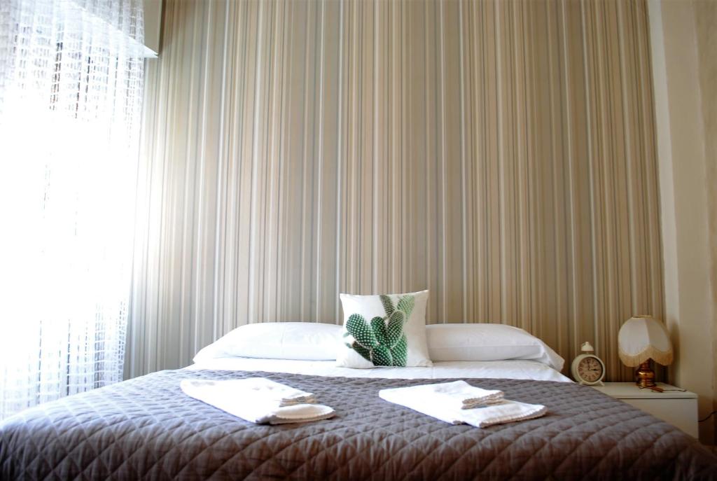 Posteľ alebo postele v izbe v ubytovaní Dreaming Piazza Bra Rooms