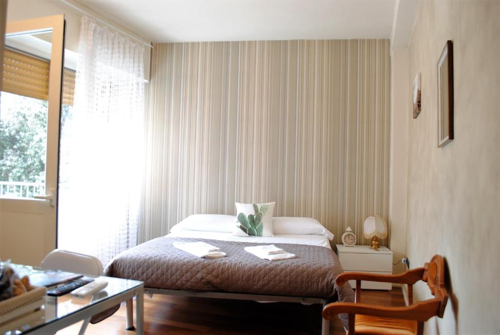 Posteľ alebo postele v izbe v ubytovaní Dreaming Piazza Bra Rooms