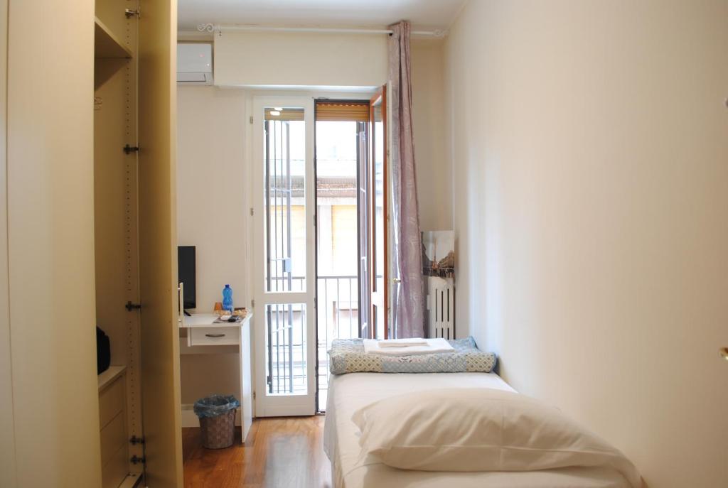 Posteľ alebo postele v izbe v ubytovaní Dreaming Piazza Bra Rooms