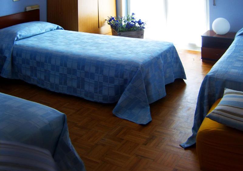 Postel nebo postele na pokoji v ubytování Hotel Blu