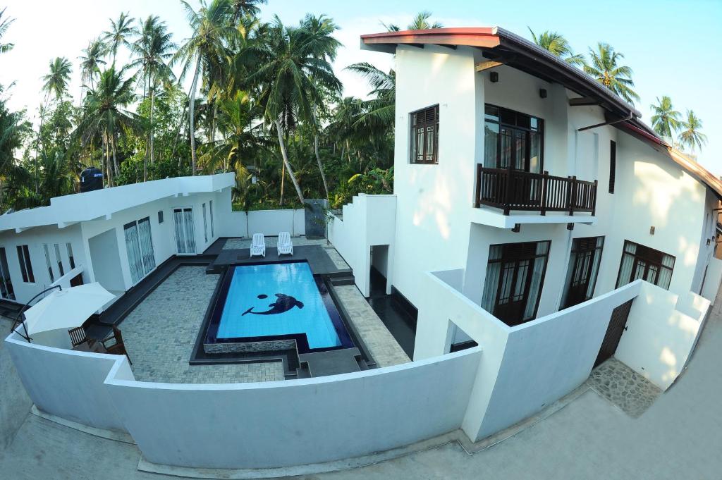 an aerial view of a house with a swimming pool at Sethum Villa in Unawatuna