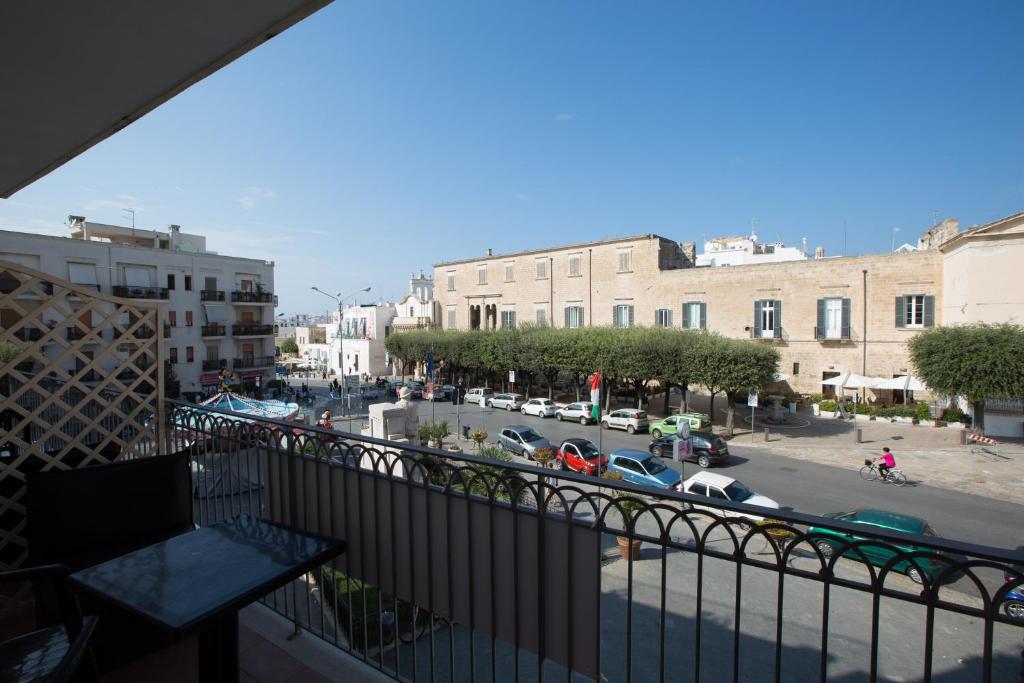 a view of a city street from a balcony at Versomare in Polignano a Mare