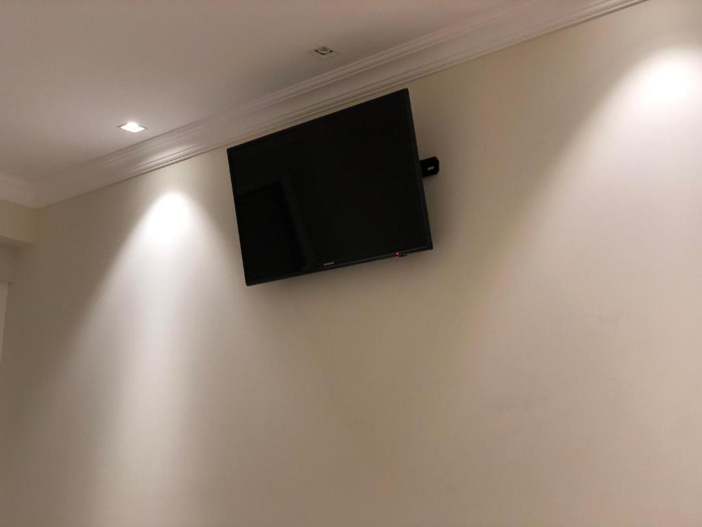 Televízia a/alebo spoločenská miestnosť v ubytovaní Rentxacobeo
