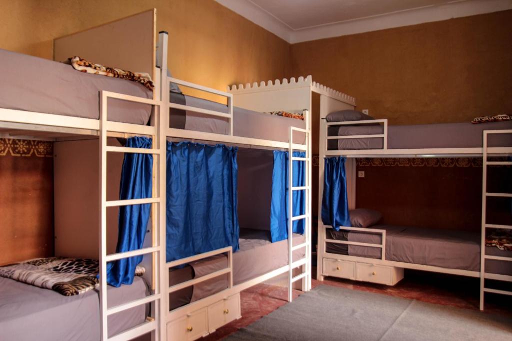 Postel nebo postele na pokoji v ubytování Kasbah Red Castel Hostel