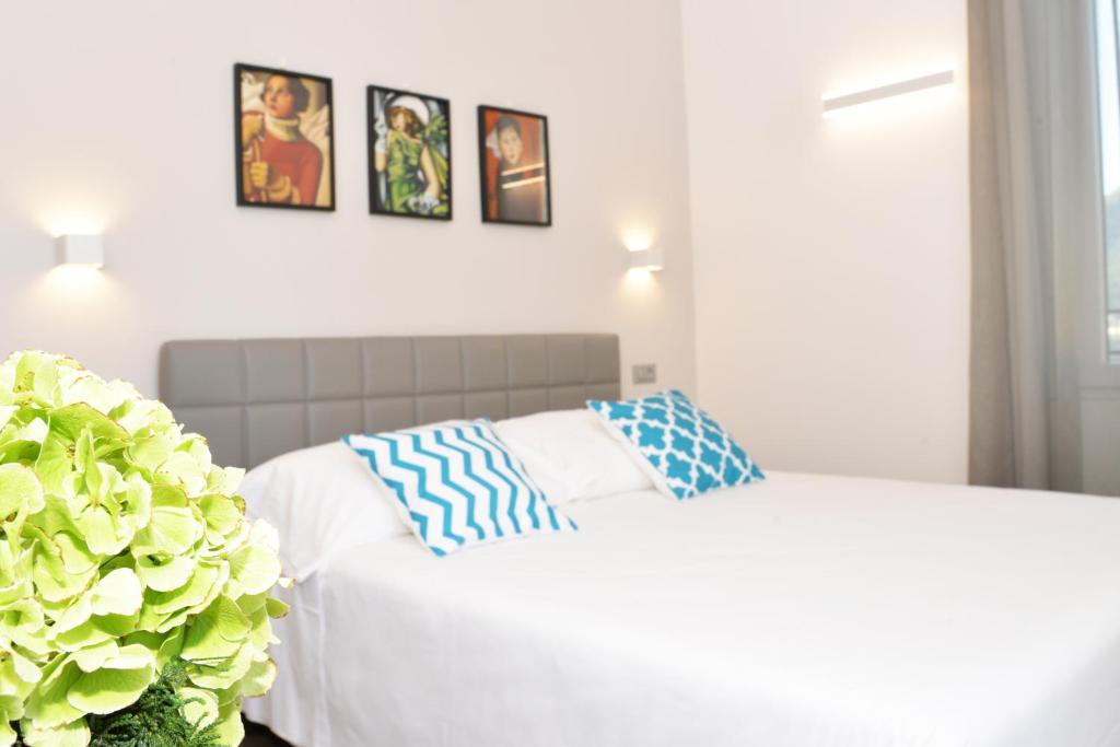 Postel nebo postele na pokoji v ubytování Hotel Quarcino