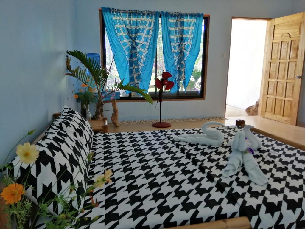 Postel nebo postele na pokoji v ubytování Andnindot garden resort