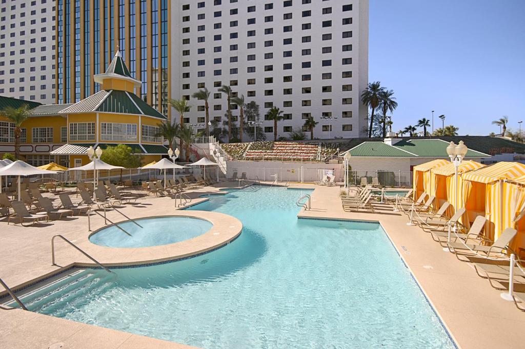 a large swimming pool with chairs and umbrellas at Tropicana Laughlin in Laughlin