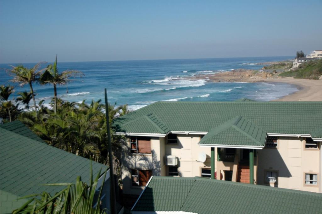 a view of a house with the ocean in the background at Ramsgate Palms D in Ramsgate