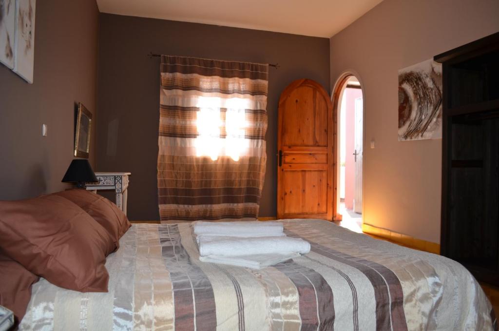 Postel nebo postele na pokoji v ubytování Casa Naima
