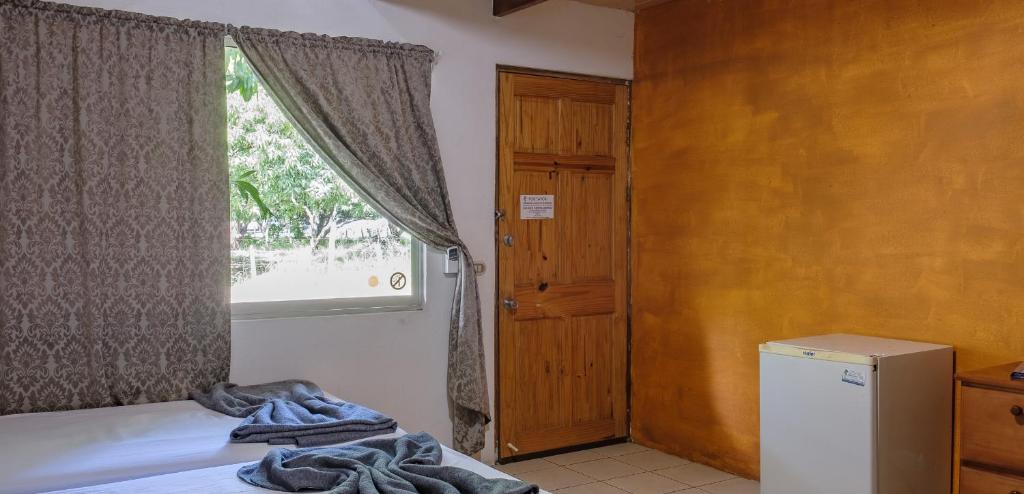 Postel nebo postele na pokoji v ubytování Mapi's Cabins