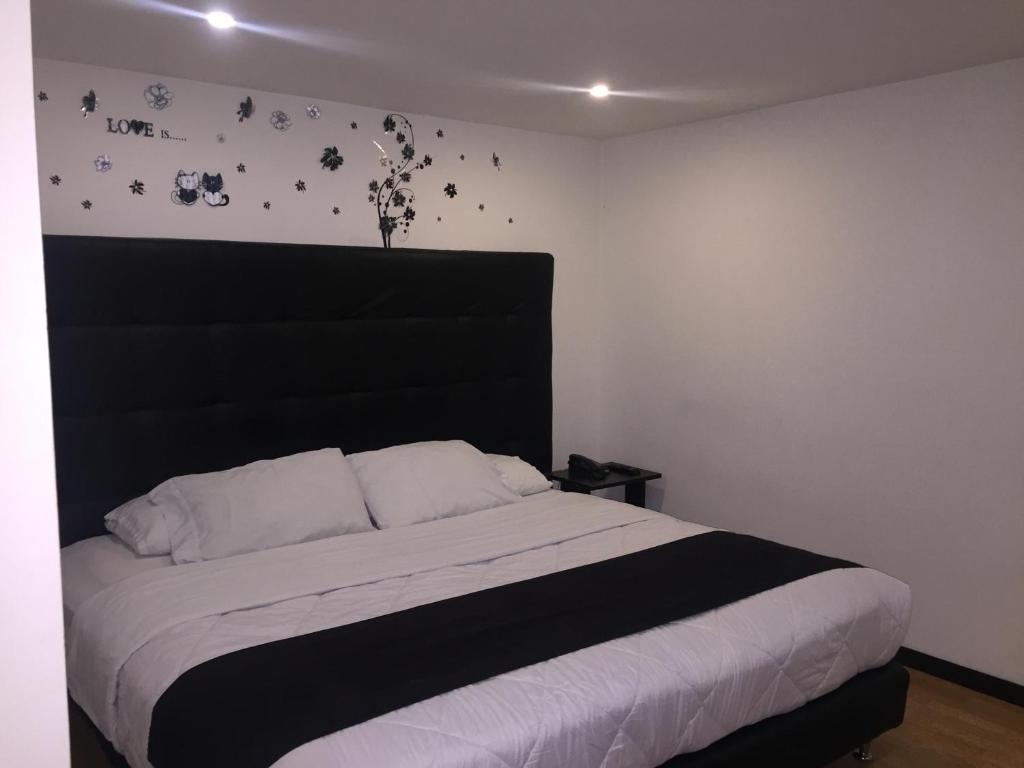 Postel nebo postele na pokoji v ubytování Hotel Montecarlo Boutique
