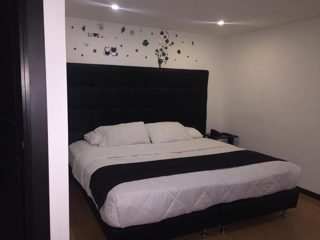 Postel nebo postele na pokoji v ubytování Hotel Montecarlo Boutique