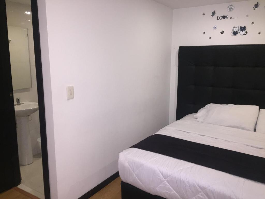 Postel nebo postele na pokoji v ubytování Hotel Montecarlo Boutique