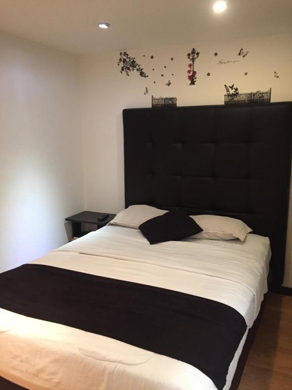 Postel nebo postele na pokoji v ubytování Hotel Montecarlo Boutique