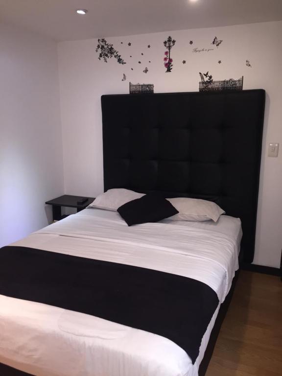 Postel nebo postele na pokoji v ubytování Hotel Montecarlo Boutique