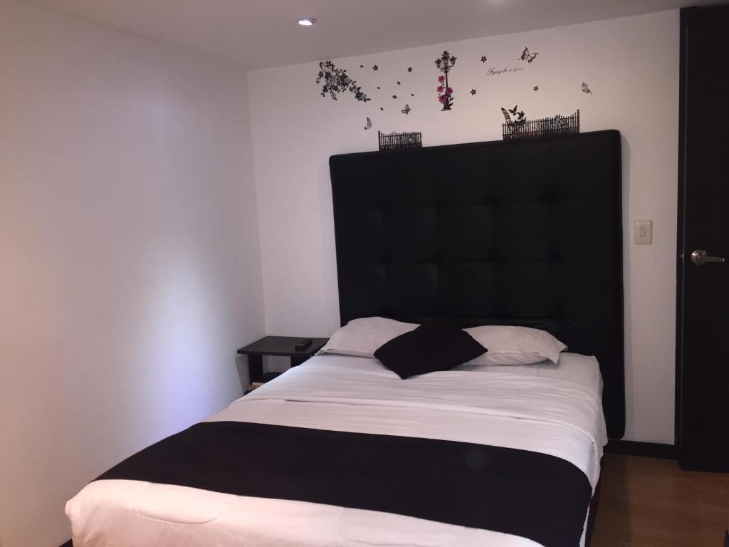 Postel nebo postele na pokoji v ubytování Hotel Montecarlo Boutique