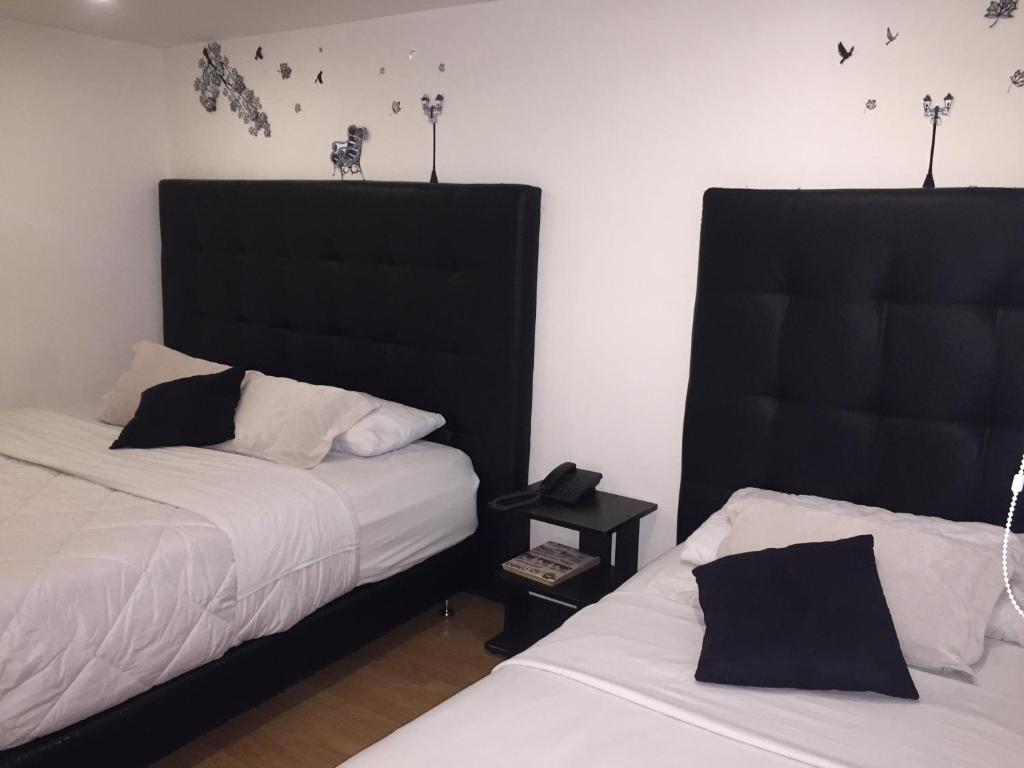 Postel nebo postele na pokoji v ubytování Hotel Montecarlo Boutique