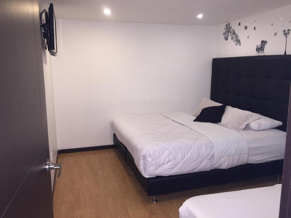 Postel nebo postele na pokoji v ubytování Hotel Montecarlo Boutique