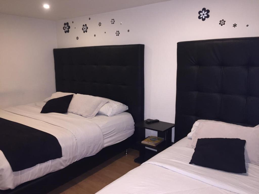 Postel nebo postele na pokoji v ubytování Hotel Montecarlo Boutique