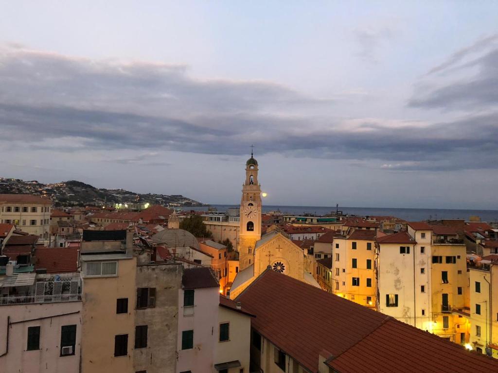 a view of a city with a clock tower at Appartamento Bellavista con parking privato, a un passo dal Teatro Ariston in Sanremo