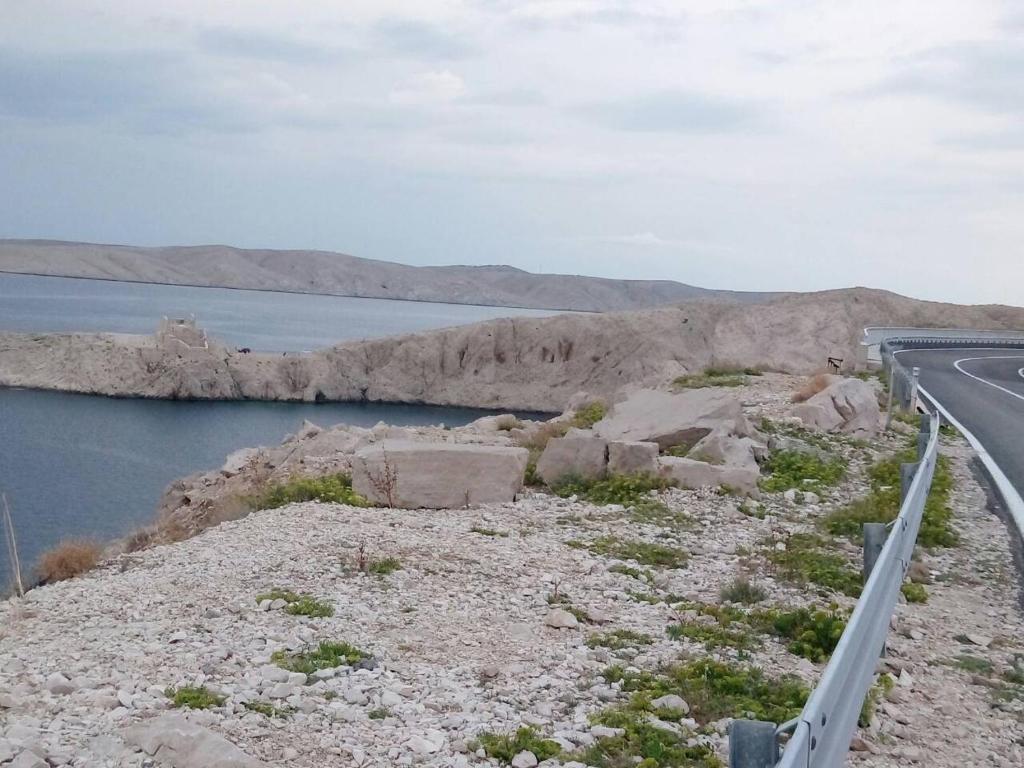 a road on the side of a body of water at Apartment Marijan - Rtina in Rtina