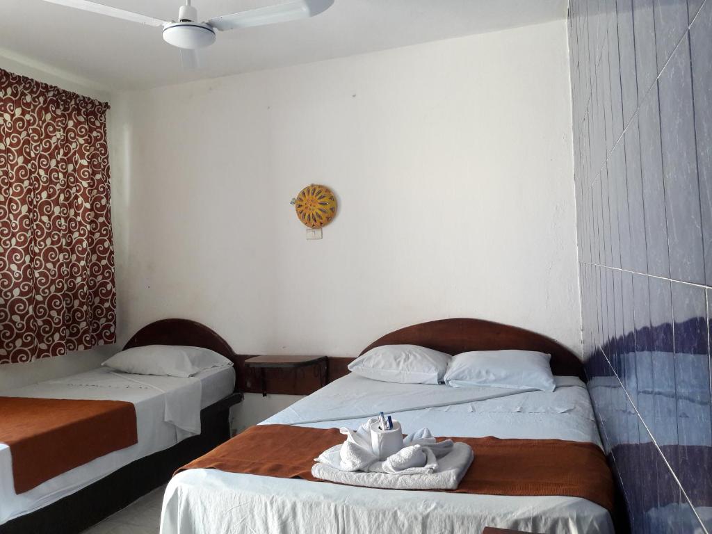 Postel nebo postele na pokoji v ubytování Hotel Naj Kin