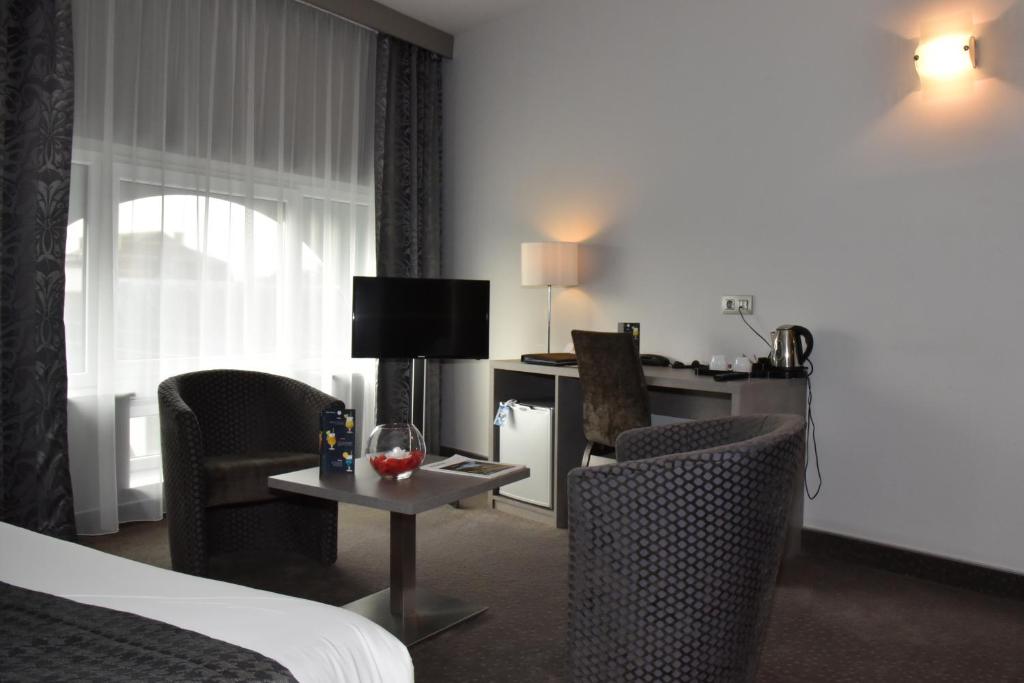 Postel nebo postele na pokoji v ubytování Hotel Saint Daniel
