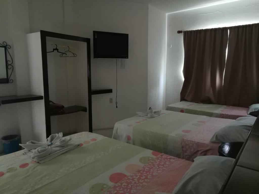 Postel nebo postele na pokoji v ubytování Hotel Naj Kin