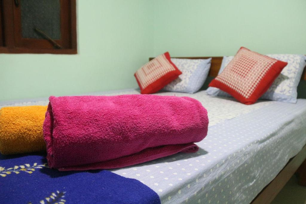 Postel nebo postele na pokoji v ubytování Apple Sara Home Stay