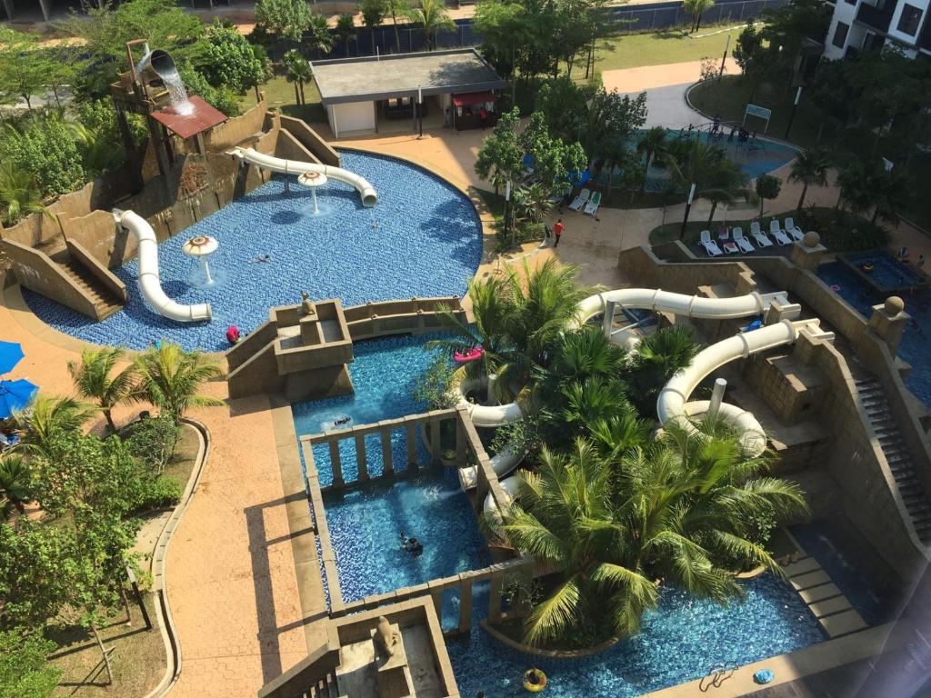 an aerial view of a water park at Cozy Swiss Garden Beach Resort Residence in Kampung Sungai Karang