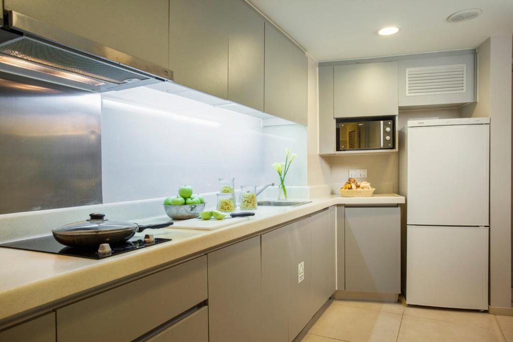 Kuchyň nebo kuchyňský kout v ubytování Citadines Zhuankou Wuhan
