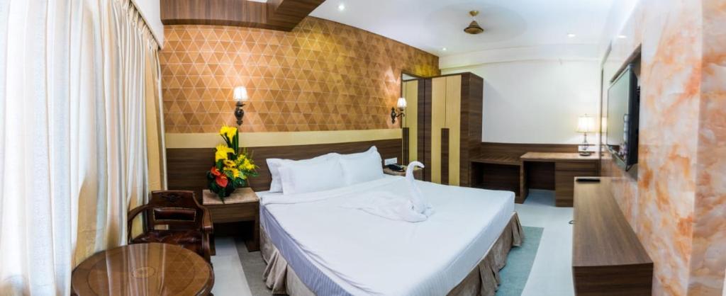 Postel nebo postele na pokoji v ubytování Hotel Grace Majestic