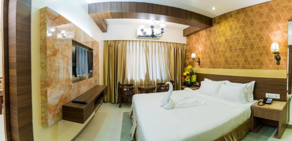 Postel nebo postele na pokoji v ubytování Hotel Grace Majestic