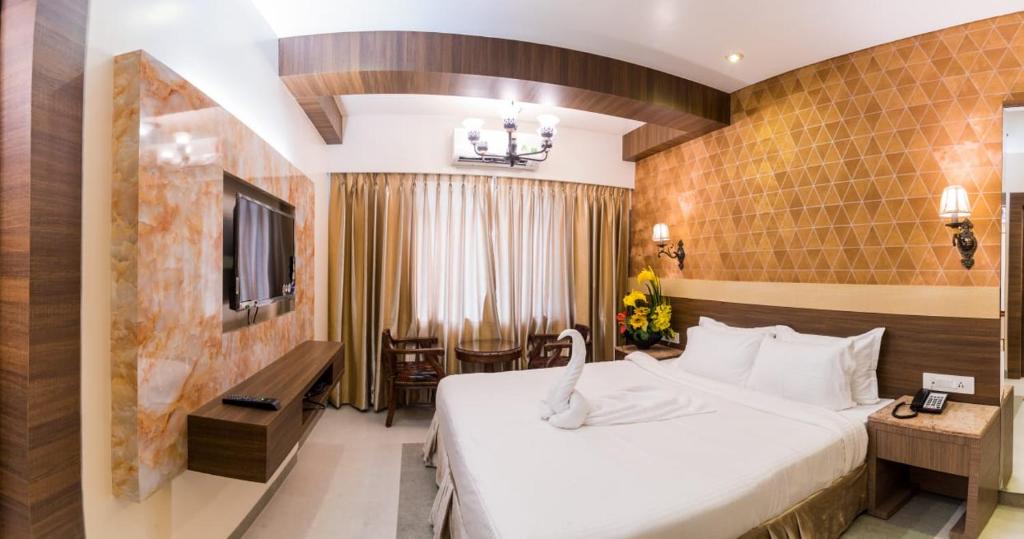 Postel nebo postele na pokoji v ubytování Hotel Grace Majestic