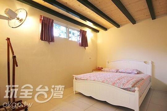 Postel nebo postele na pokoji v ubytování Dongguang Zhixing Homestay