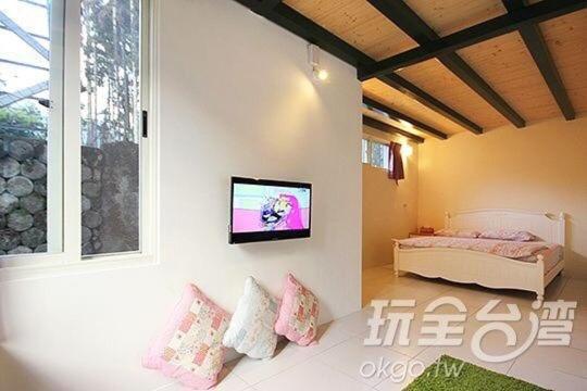 Postel nebo postele na pokoji v ubytování Dongguang Zhixing Homestay