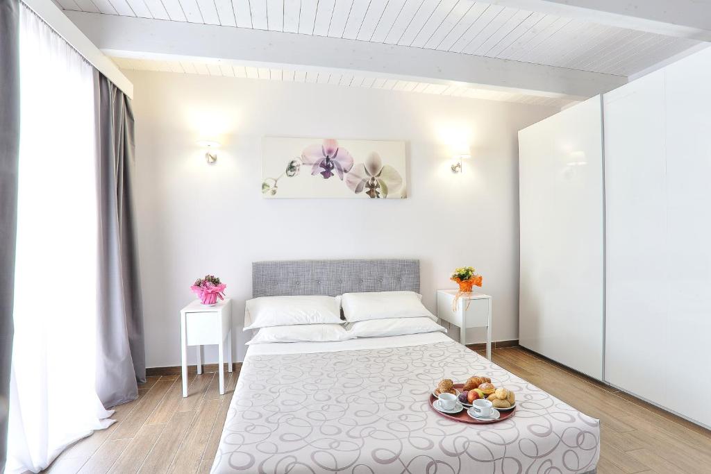 Postel nebo postele na pokoji v ubytování Hotel La Pineta