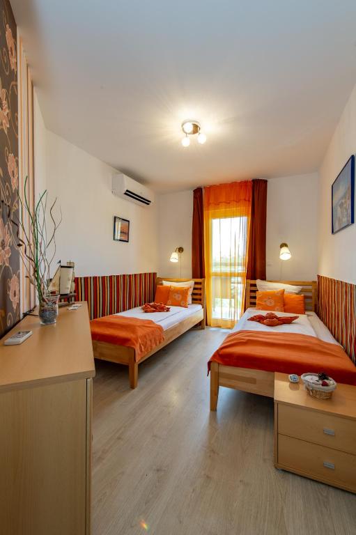 Кровать или кровати в номере Soline Bay Seashore Residence