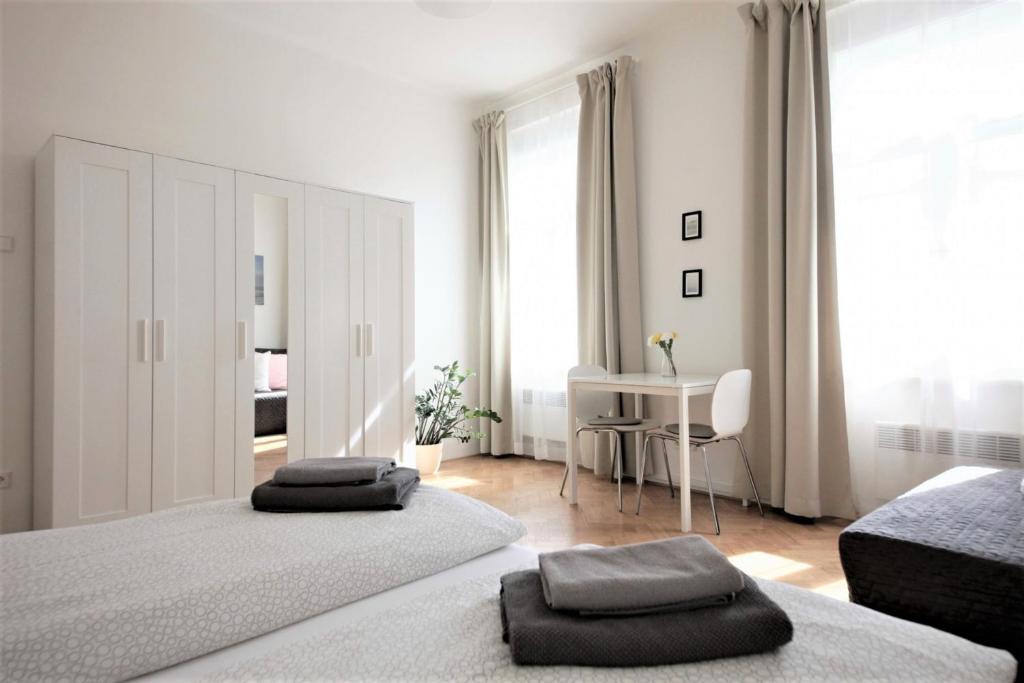 Postel nebo postele na pokoji v ubytování Angel City Aparthotel