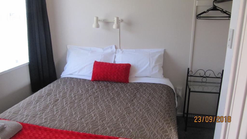 Postel nebo postele na pokoji v ubytování Ahuriri Motels