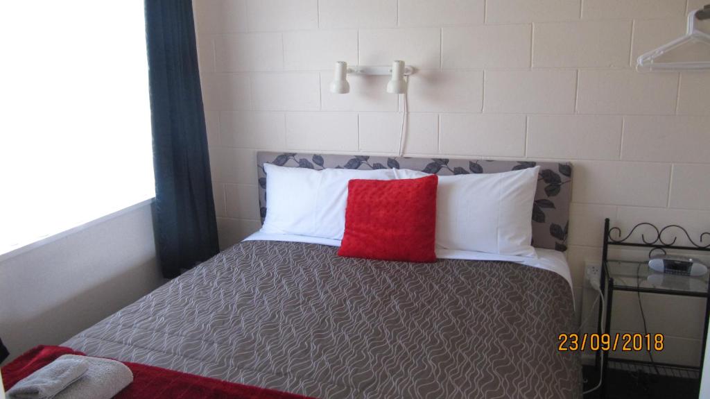 Postel nebo postele na pokoji v ubytování Ahuriri Motels