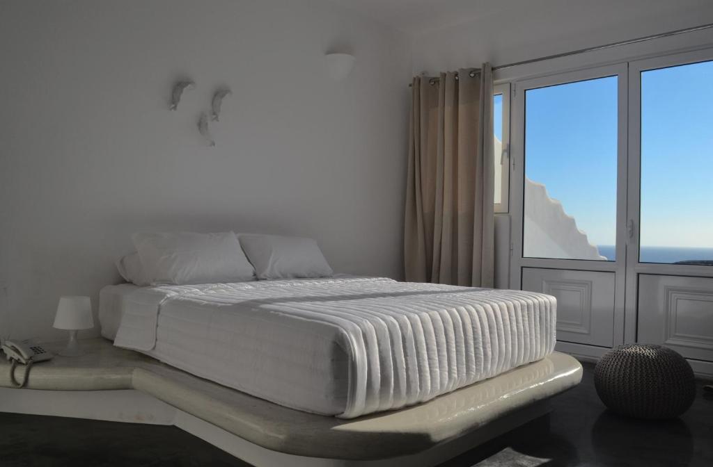 Postel nebo postele na pokoji v ubytování Golden Beach Resort Anafi