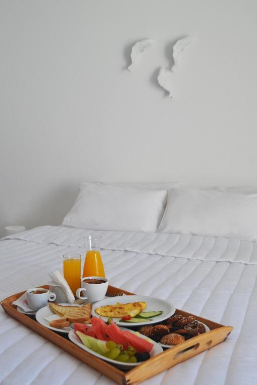 Postel nebo postele na pokoji v ubytování Golden Beach Resort Anafi