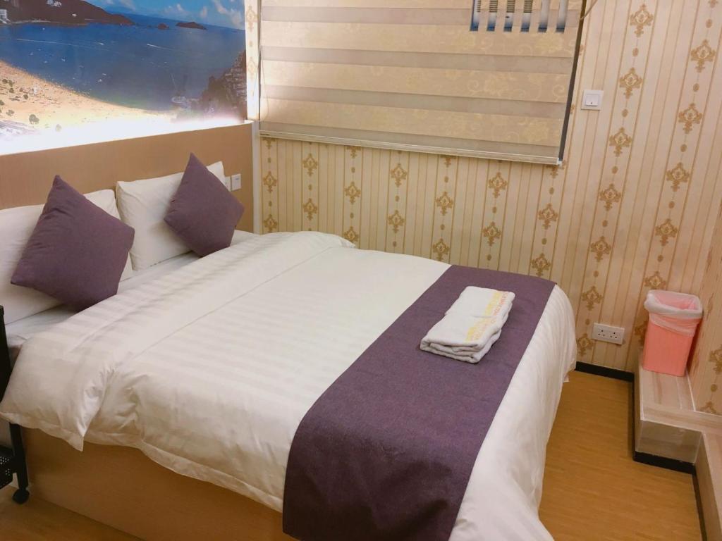 Postel nebo postele na pokoji v ubytování Whole Sunshine International Hotel