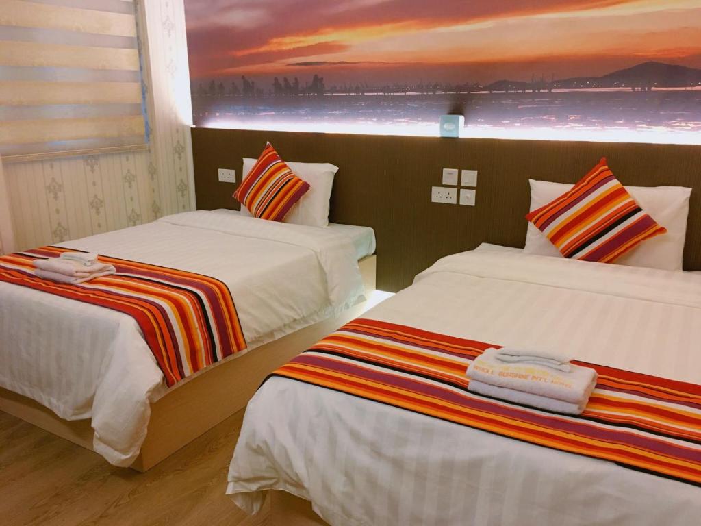 Postel nebo postele na pokoji v ubytování Whole Sunshine International Hotel