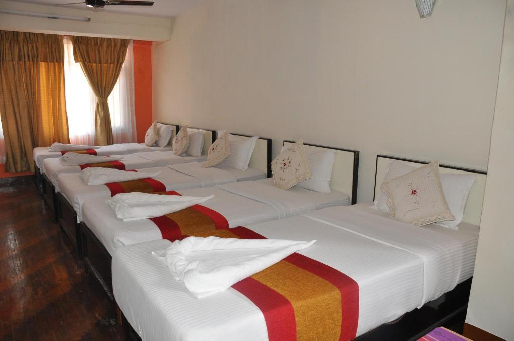 Postel nebo postele na pokoji v ubytování Hotel Pleasure Home