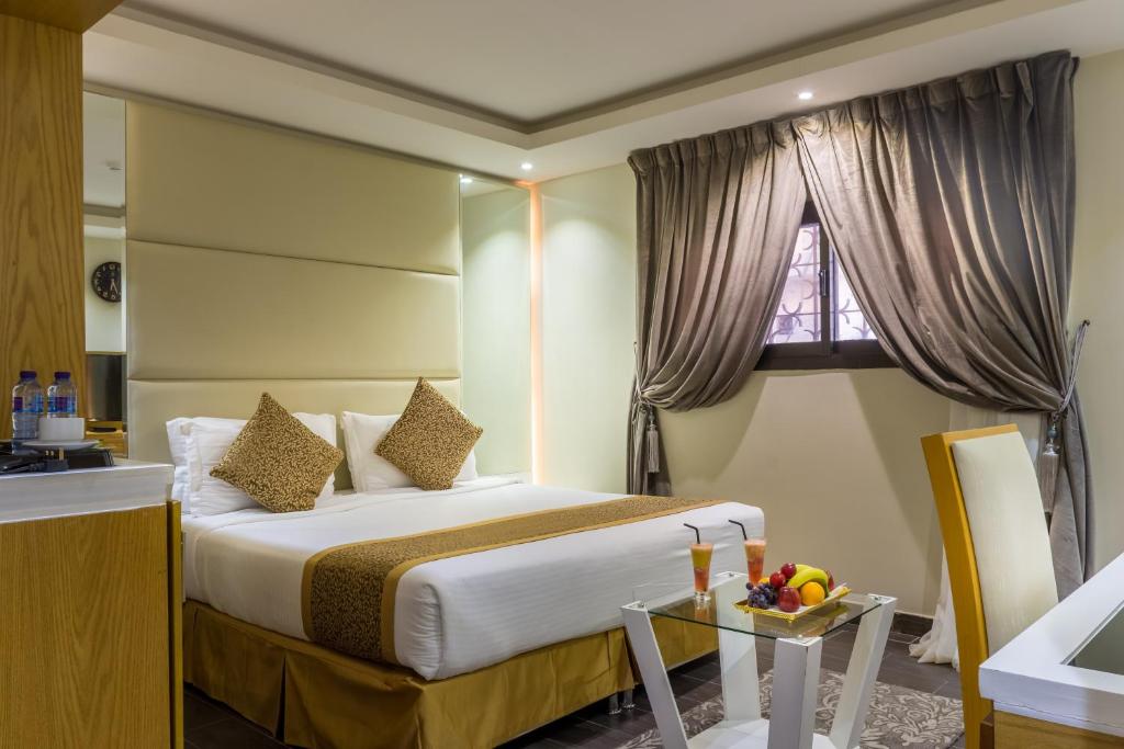 เตียงในห้องที่ Al Muhaidb Al Takhasosi Hotel