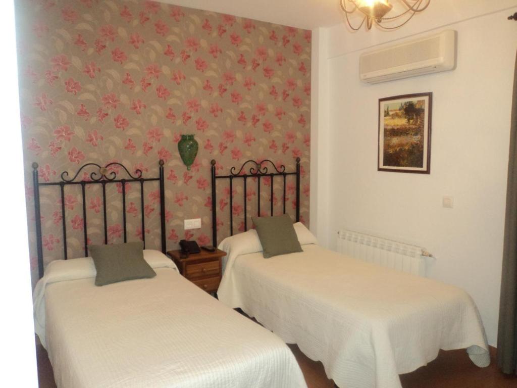 Postel nebo postele na pokoji v ubytování Hotel San Julian