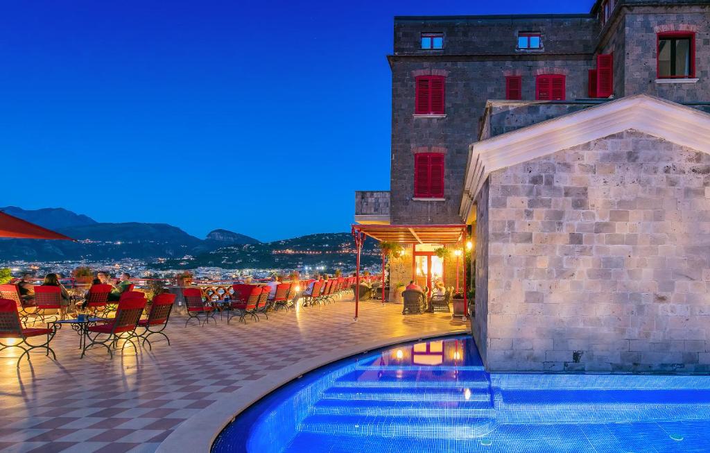 a hotel with a swimming pool in front of a building at Hotel Minerva in Sorrento