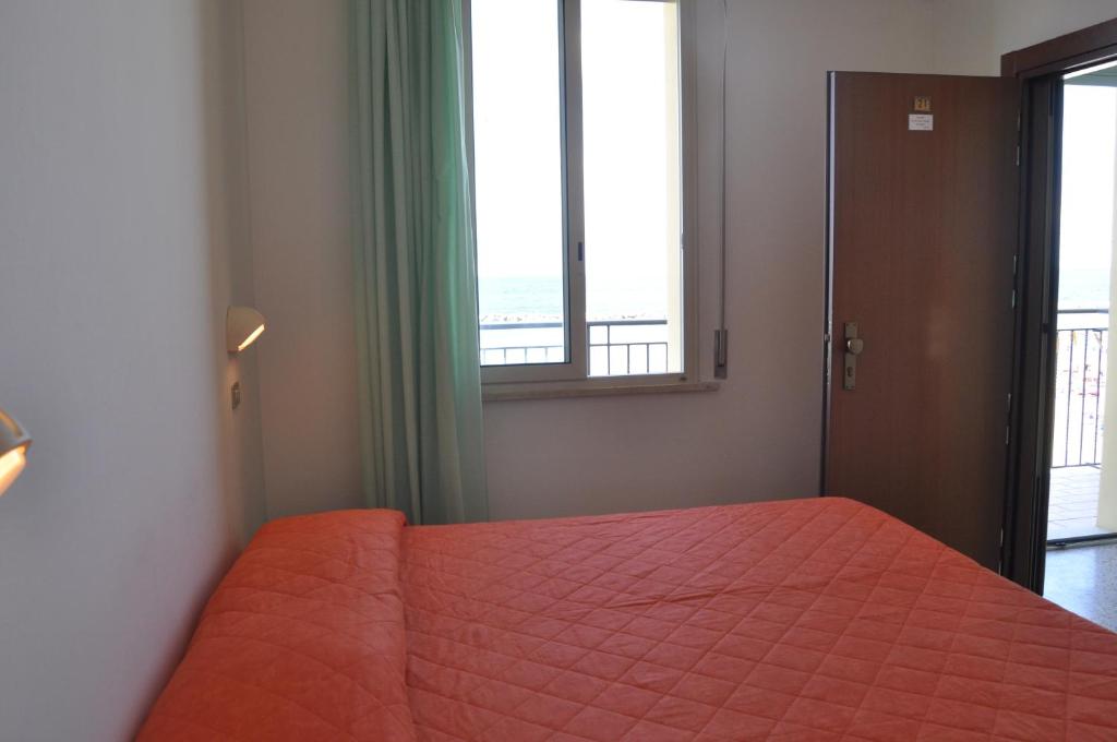 Postel nebo postele na pokoji v ubytování Hotel Acapulco sul mare